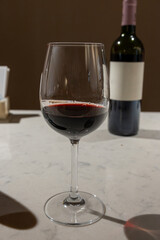 Tasting of red dry Saint-Emilion wine aged in French oak wooden barrels in cellar, Saint-Emilion wine making region, France, Bordeaux