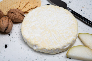 French soft Cremeux de Normandie cheese, soft creamy cheese with white mold