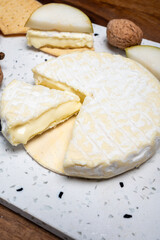 French soft Cremeux de Normandie cheese, soft creamy cheese with white mold