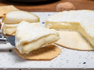 French soft Cremeux de Normandie cheese, soft creamy cheese with white mold