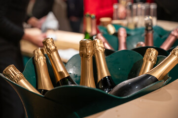 Bottles of sparkling wine champagne on winter weekend festival in December on Avenue de Champagne,...