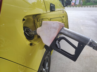 Selectively focus on the white fuel pump nozzle. special subsidized pertalite nozzles