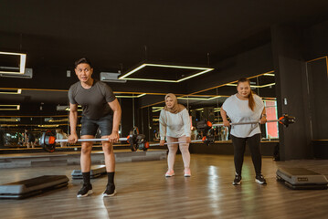 sporty people doing fitness in gym for weight loss program