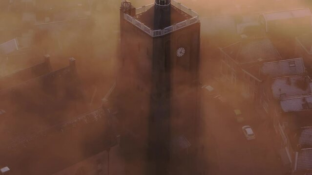 Aerial drone view of church foggy morning, Workum, Friesland, Netherlands