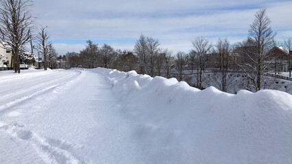 Fototapeta na wymiar sidewalk covered with snow (no one walking yet)
