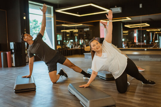 healthy activity of sporty people doing exercise in gym