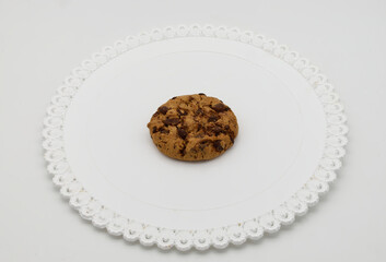 Cookie with chocolate chips isolated on white background.