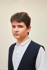 A high school student in uniform on a white background.