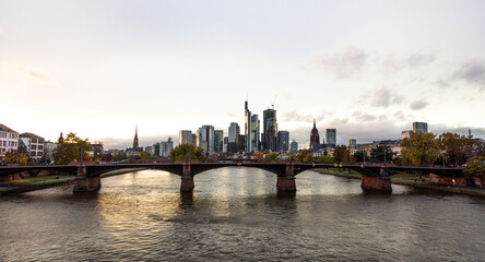 Frankfurt skyline with the bridge at sunset, - obrazy, fototapety, plakaty