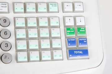 Cash register accounting calculation with plastic keyboard and keys of a desktop calculator