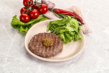 Frilled beef burger cutlet with iceberg
