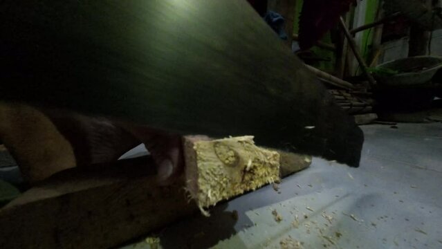 b-roll video clip of me sawing wood and seen from a fairly close distance