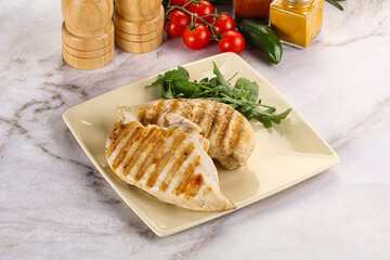 Grilled chicken breast served arugula