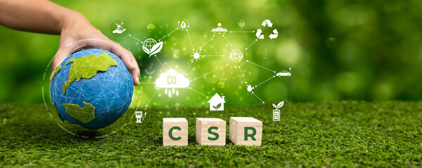 Businessman's hand holding Earth globe symbolize corporate commitment to CSR practice to reduce...