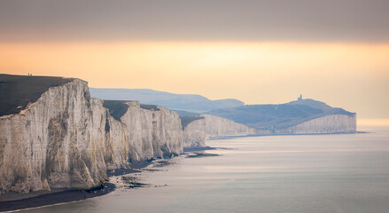 Dramatic cliff face of the Seven sisters between Cuckmere Haven and Birling Gap on the east Sussex coast south east England UK - obrazy, fototapety, plakaty
