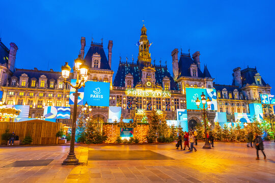Paris city hall. View of the colorful city Hall building,  the Christmas market square and Olympic sign