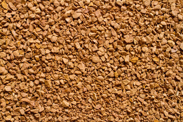 The texture of granulated instant coffee. Background texture of coffee powder.