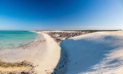 Panorama of Mamirano bay taken from a white dune. At the foot of the dune a Vezo village. Tulear, Madagascar