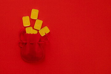 Chinese New Year  festival decorations, golden, flowers, paper fan, Chinese lanterns, envelopes on red background. Flat lay, top view, Text space images