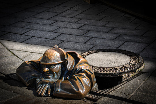 The Famous Statue of Cumil the Sewer Worker in Bratislava, Slovakia
