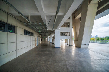 Spacious Corridor of Urban Convention Center Under Cloudy Sky
