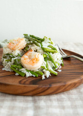 plate of basmati rice with asparagus and shrimp on the table