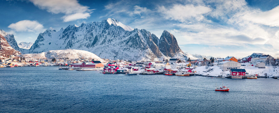 Panoramic winter view of Gravdal bay. Stunnig morning scene of popular tourist destination - Lofoten Islands, Norway. Beautiful seascape of Norwegian sea. Nice winter landscape of Sakrisoy village.