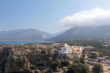 Fototapeta na wymiar Chania town Crete island, Greece, Chrysoskalitissa Monastery built up on rock. Aerial drone view.