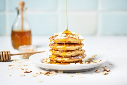 muesli pancakes with syrup and a dusting of powdered sugar