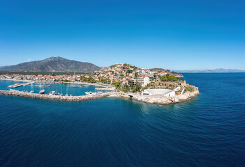 Fototapeta na wymiar Paralio Astros port, Arcadia, Peloponnese, Greece. Aerial drone view of town, breakwater, boat, sea.