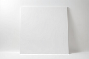 A blank white canvas against a full white background - Mockup - obrazy, fototapety, plakaty