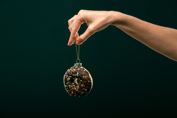 Donuts, bun, croissant Christmas toy on a black background. Creative collage.