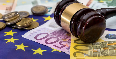 financial judgment with judge's gavel different Euro banknotes