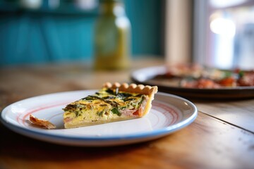 half-eaten quiche on a plate showing texture