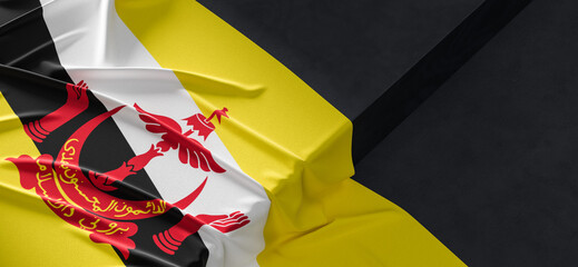 Flag of Brunei. Fabric textured Brunei flag isolated on dark background. 3D illustration - obrazy, fototapety, plakaty