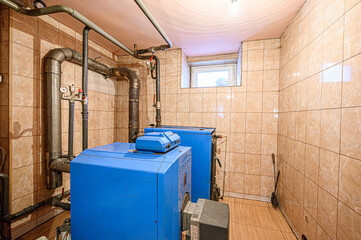 interior apartment room boiler room. heating system, pipes and appliances