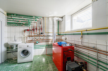 interior apartment room boiler room. heating system, pipes and appliances