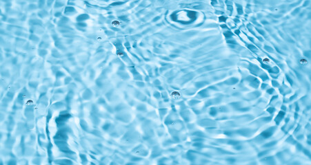 Water surface waving Close-up . Blue Water Flowing