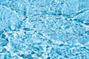 Fototapeta na wymiar Water surface waving Close-up . Blue Water Flowing