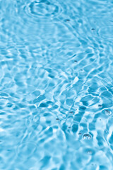 Water surface waving Close-up . Blue Water Flowing