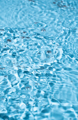 Water surface waving Close-up . Blue Water Flowing