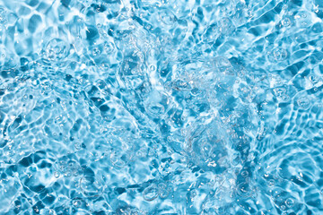 Water surface waving Close-up . Blue Water Flowing
