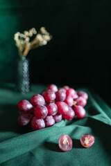 Fresh Red Grapes on a Green Canvas