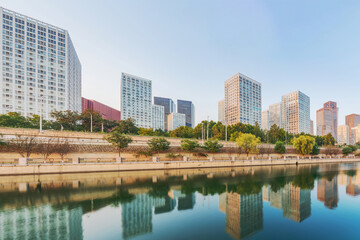 Fototapeta na wymiar The modern urban architecture skyline and ancient canal scenery of Beijing, the capital of China 