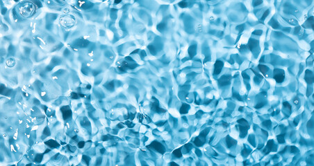 Water surface waving Close-up . Blue Water Flowing
