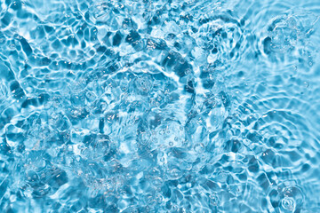 Water surface waving Close-up . Blue Water Flowing