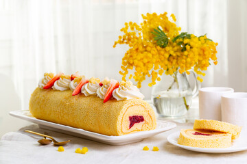 Women's Day breakfast on March 8. Rolled sponge Mimosa cake filled with custard cream and berry...