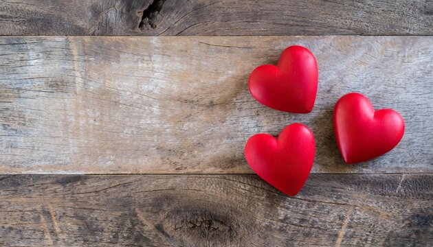 three red hearts on wooden background valentine day concept