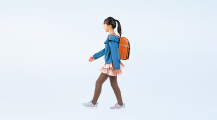 Fototapeta na wymiar ランドセルを背負って歩く女子小学生（切り抜き背景透過PNGも販売しております。作成者リンクから「PNG」で検索してください）