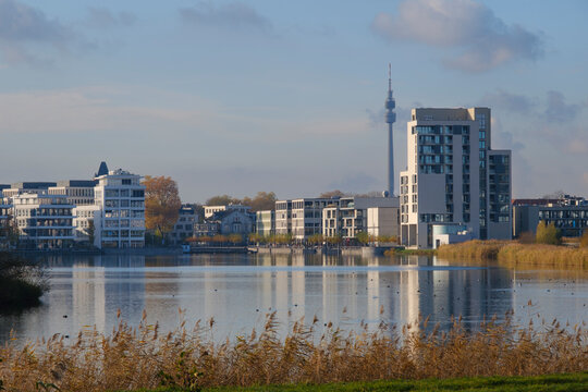 Germany, North Rhine Westphalia, Dortmund, Lake Phoenix with city buildings in background